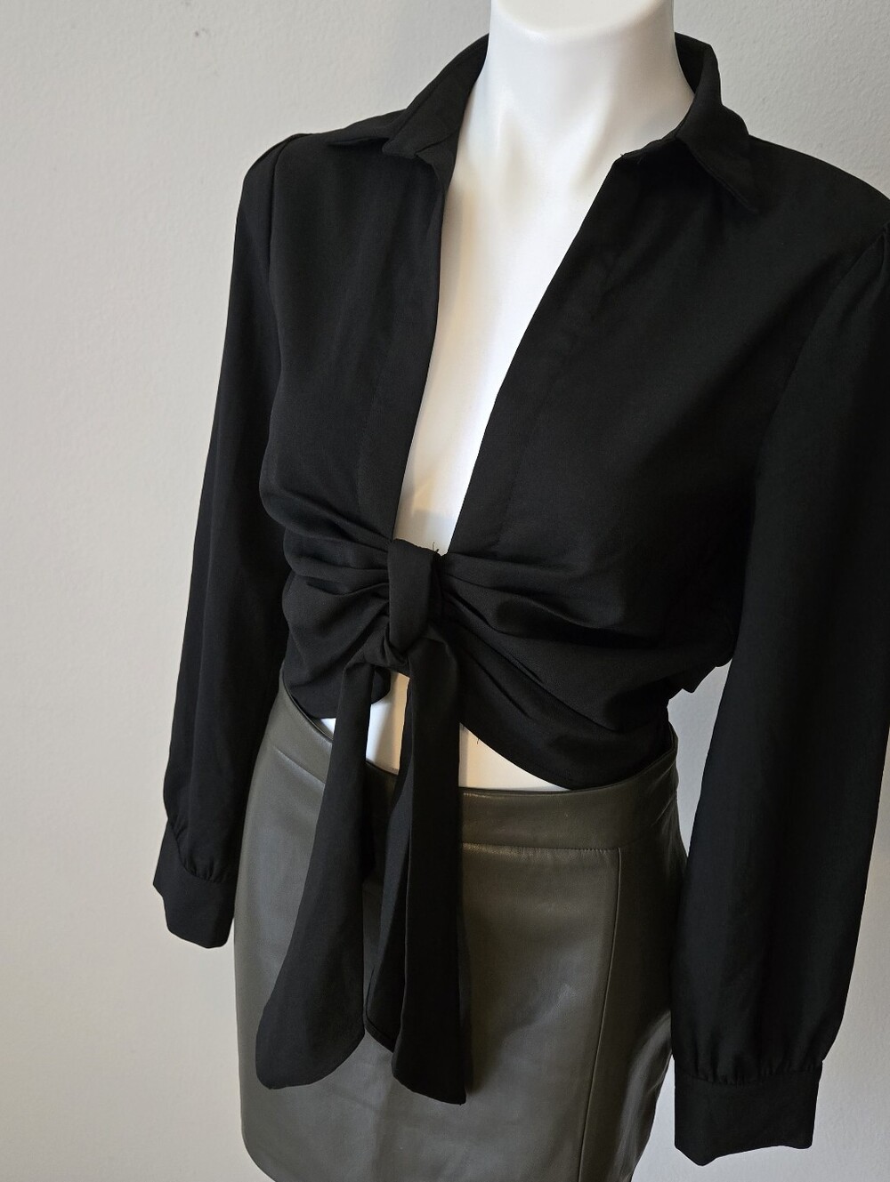 Blue Blush black long-sleeve blouse with a front tie.